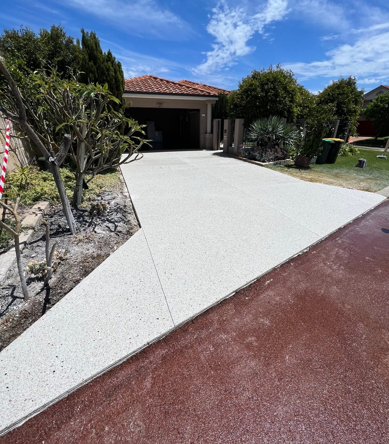 Exposed aggregate driveway across a full frontage in Glen Waverley