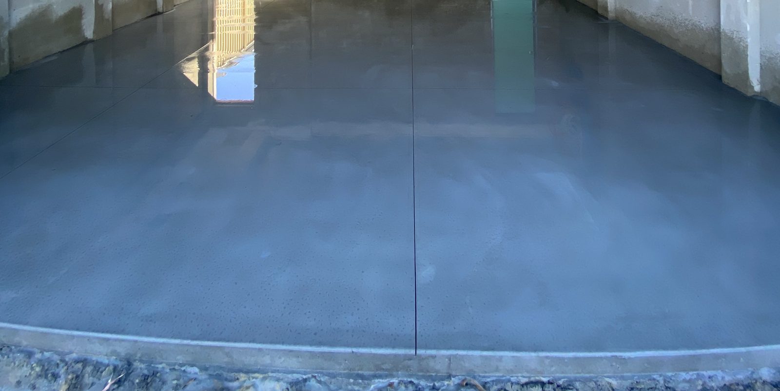 Fresh concrete shed slab at a Mulgrave property